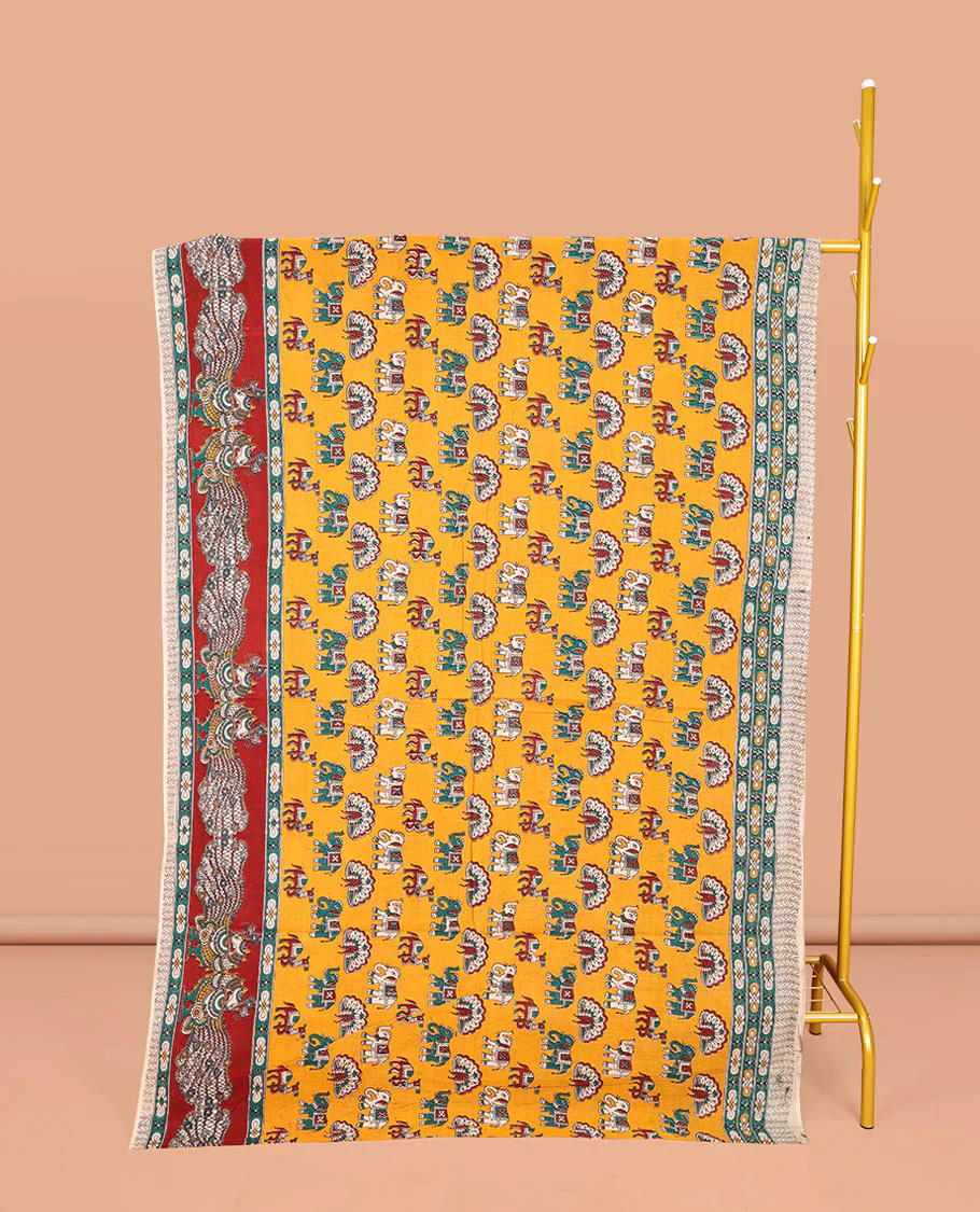 Orange Machine-Printed Kalamkari Cotton Saree, Accentuated with Peacock, Elephant, and Camel Motifs  on Its Body, Complemented by a Contrast Border of Peacock Print, Pallu of Leaf Print, and Paired with a Printed Blouse