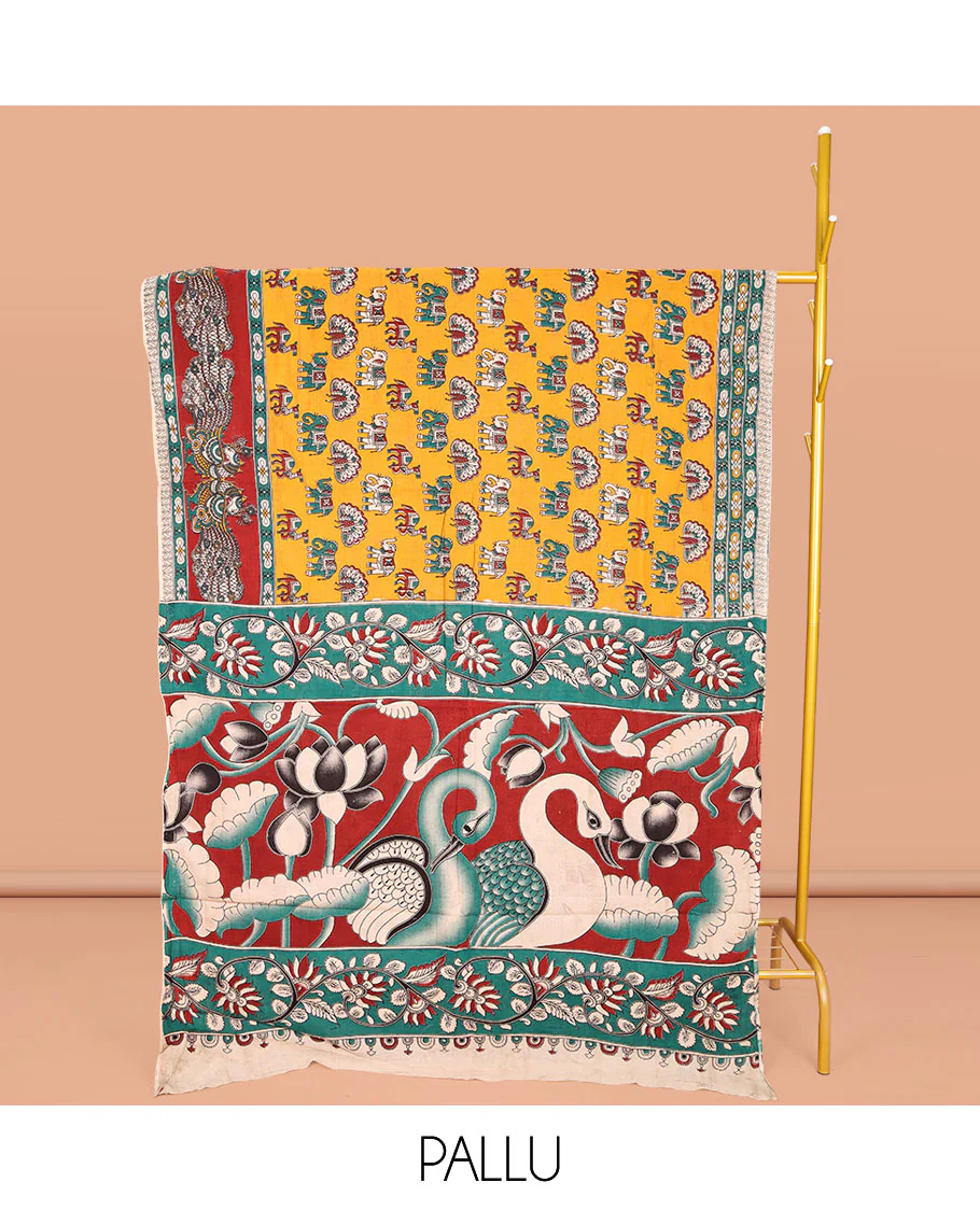 Orange Machine-Printed Kalamkari Cotton Saree, Accentuated with Peacock, Elephant, and Camel Motifs  on Its Body, Complemented by a Contrast Border of Peacock Print, Pallu of Leaf Print, and Paired with a Printed Blouse - Image 2