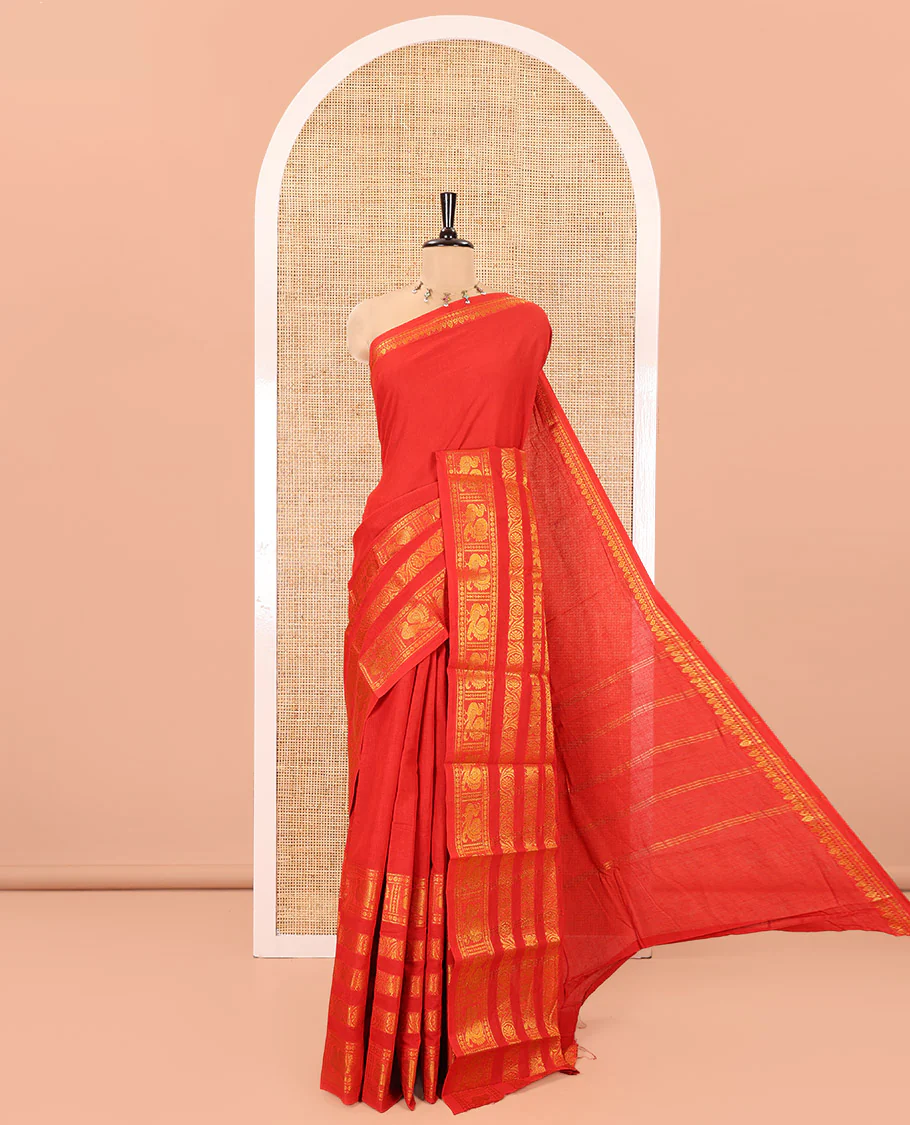 Orange Plain Sungudi Cotton Saree, Highlighted by Traditional Zari Border of Peacock and Floral Creeper Designs, Subtly Striped Pallu, and Paired with a Contrast Blouse