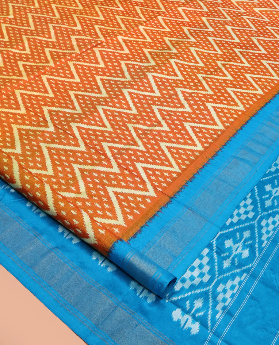 Orange Pochampally Ikat Silk Saree, Ornamented with Buttas and Chevron Design on Its Body, Complemented by a Contrast Border, Pallu of Jaal Designs in Ikkat Weave, and Paired with a Contrast Blouse - Image 2