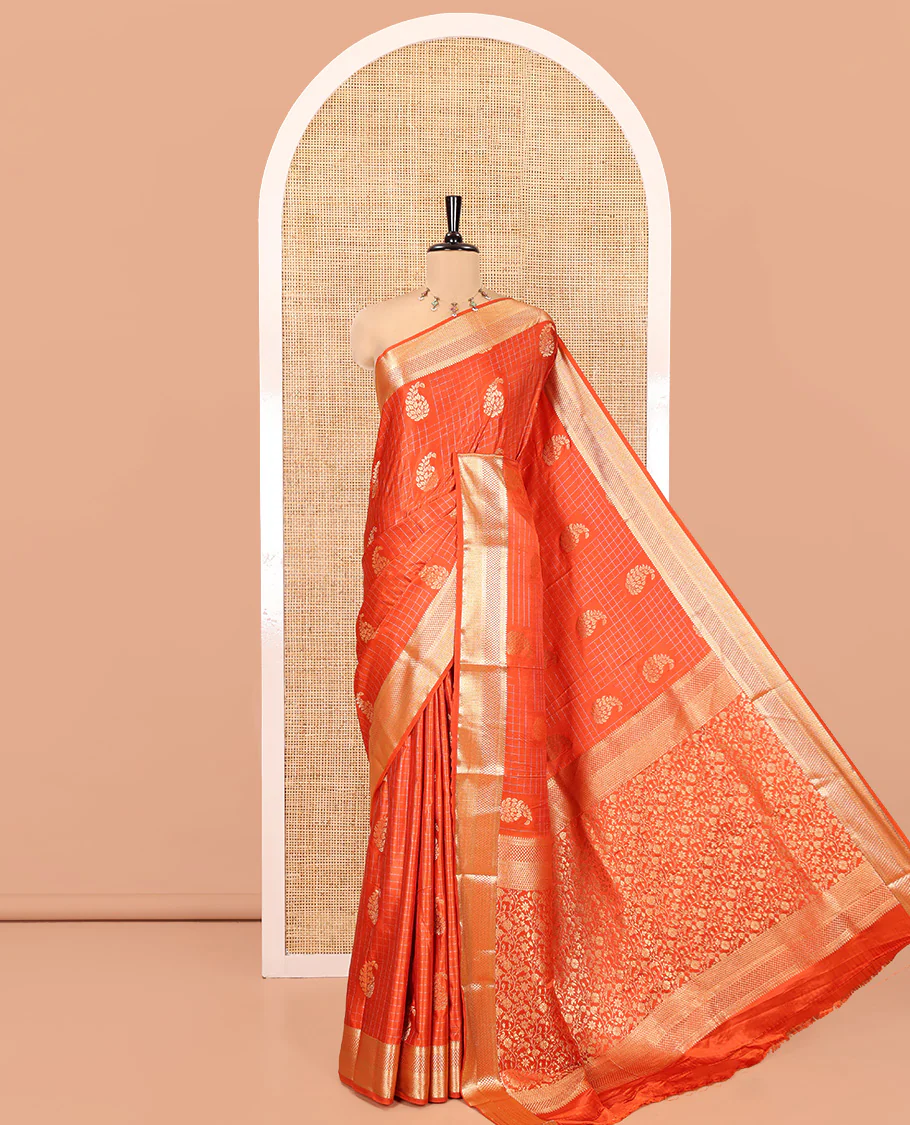 Orange Satin Silk Saree, Enriched with Paisleys and Zari Checked Design on Its Body, Highlighted by Zari Traditional Design Border, Floral Jaal Pallu, and Paired with a Matching Blouse