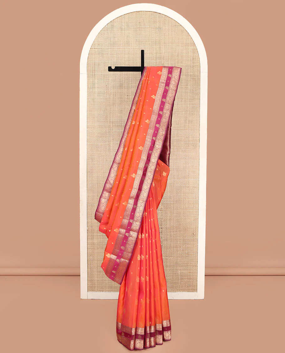 Orange Vasundhara Lite Silk Mix Saree, Accentuated with Zari Buttas, Complemented by a Contrast Border of Thilakam Mokku, and Kodi Visiry Designs, Pallu of Floral Jaal Designs, and Paired with a Contrast Blouse