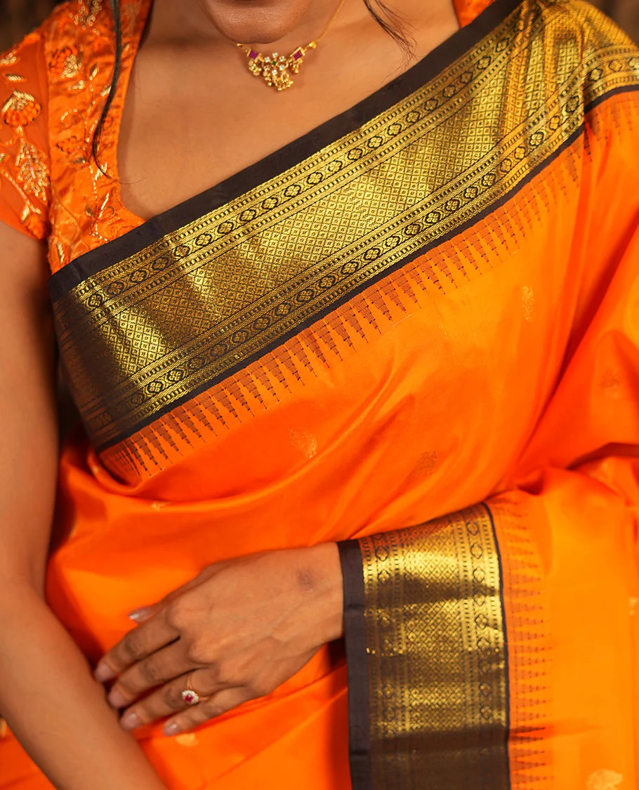 Orange Vasundhara Silk Saree, Artfully Woven with Mayil Buttas All Over Its Body, Complemented by Contrast Border Featuring Thazampoo Rekku, Muthu, Lavangam, and Mayil Kann Designs, a Grand Pallu of Jaal Designs, and Paired with a Contrast Blouse - Image 2