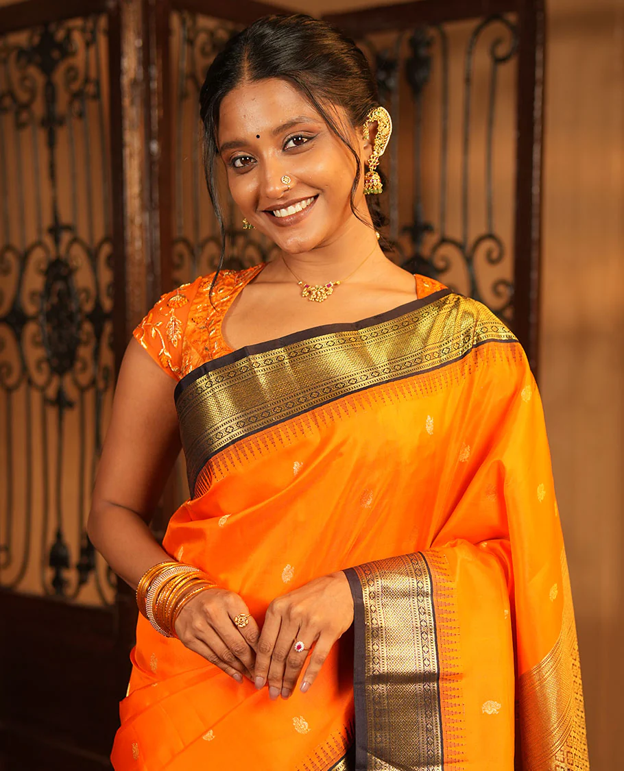 Orange Vasundhara Silk Saree, Artfully Woven with Mayil Buttas All Over Its Body, Complemented by Contrast Border Featuring Thazampoo Rekku, Muthu, Lavangam, and Mayil Kann Designs, a Grand Pallu of Jaal Designs, and Paired with a Contrast Blouse - Image 3