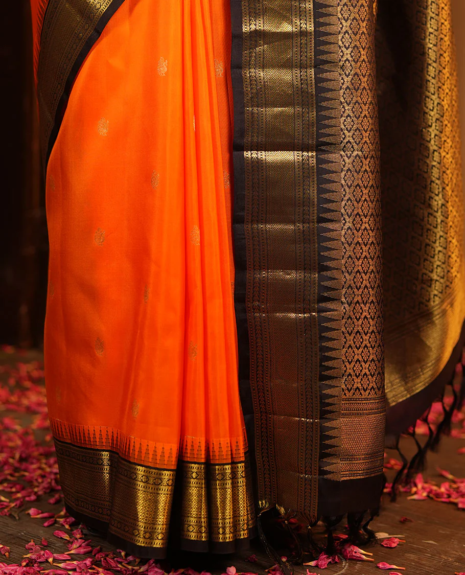 Orange Vasundhara Silk Saree, Artfully Woven with Mayil Buttas All Over Its Body, Complemented by Contrast Border Featuring Thazampoo Rekku, Muthu, Lavangam, and Mayil Kann Designs, a Grand Pallu of Jaal Designs, and Paired with a Contrast Blouse - Image 5
