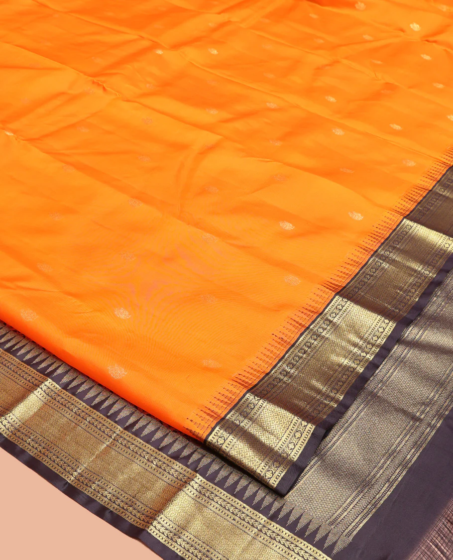 Orange Vasundhara Silk Saree, Artfully Woven with Mayil Buttas All Over Its Body, Complemented by Contrast Border Featuring Thazampoo Rekku, Muthu, Lavangam, and Mayil Kann Designs, a Grand Pallu of Jaal Designs, and Paired with a Contrast Blouse - Image 7