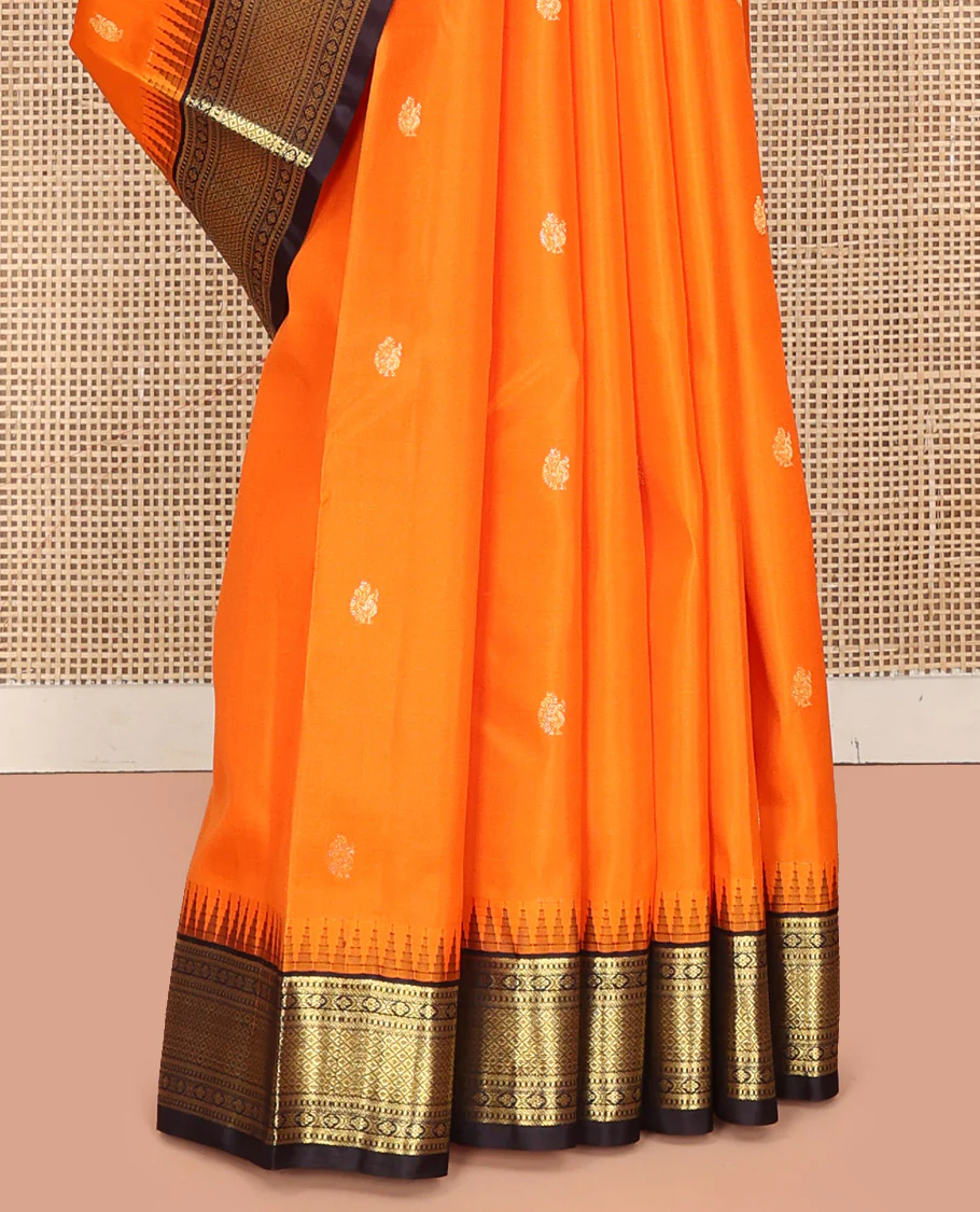 Orange Vasundhara Silk Saree, Artfully Woven with Mayil Buttas All Over Its Body, Complemented by Contrast Border Featuring Thazampoo Rekku, Muthu, Lavangam, and Mayil Kann Designs, a Grand Pallu of Jaal Designs, and Paired with a Contrast Blouse - Image 9