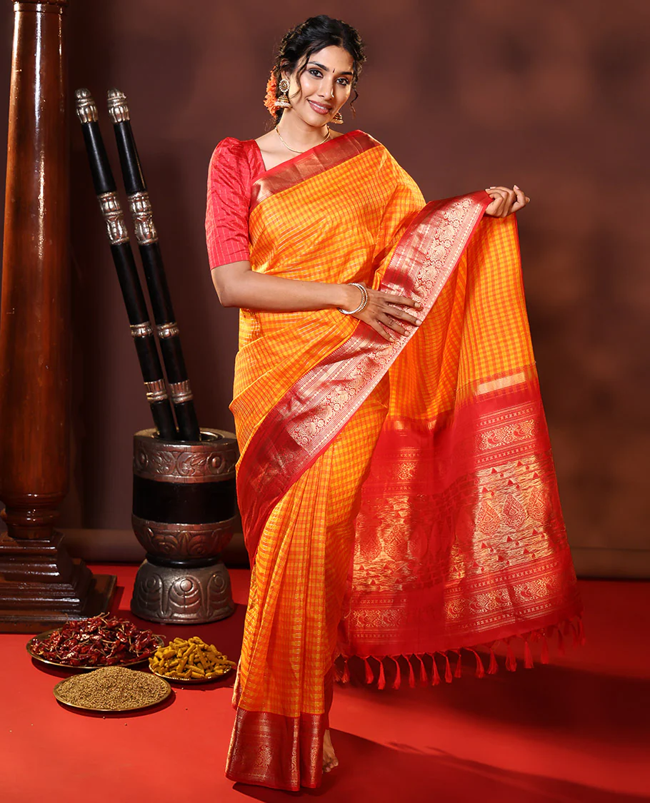 Orange Vasundhara Silk Saree Decked Up with Checks All Over Its Body, Complemented by Contrast Border of Rekku, Neli, Rudraksham, Kathir, and Mayil Designs, a Grand Pallu of Intricate Designs, and Paired with a Contrast Blouse - Image 3