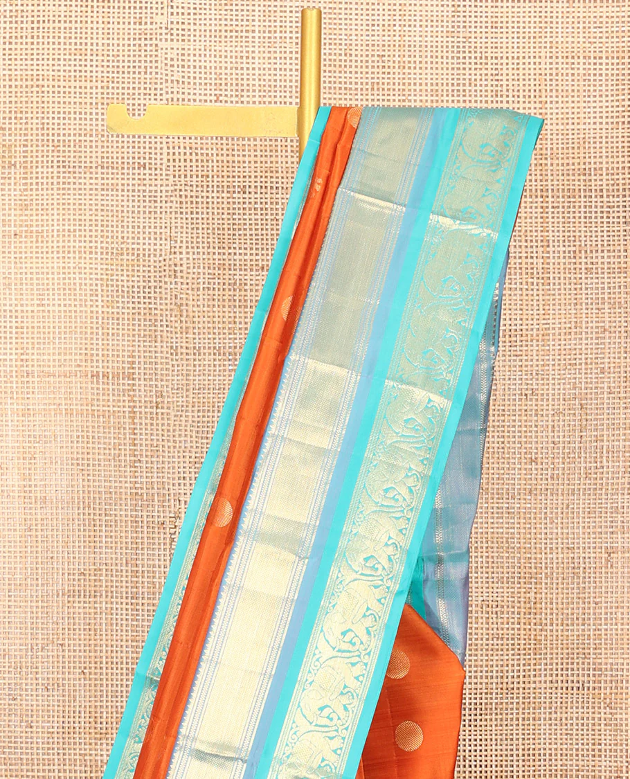 Orange Vasundhara Silk Saree Embellished with Yaanai and Poun Buttas All Over Its Body, Complemented by Zari Border of Neli, Mayil Kann, and Yaanai Designs, a Grand Pallu of Jaal Designs, and Paired with a Contrast Blouse - Image 3
