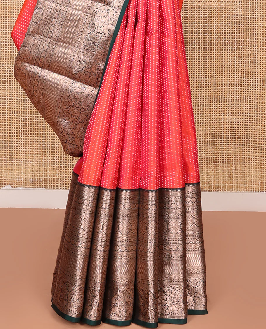 Orange Vasundhara Silk Saree Gracefully Embellished with Dobby-Style Zari Buttas, Highlighted by a Contrast Border of Rekku, Kathir, Cross Kamalam, Chakram, Mayil Kann, Mayil, and Yaanai, Scintillating Jaal Pallu, and Paired with a Contrast Blouse - Image 4