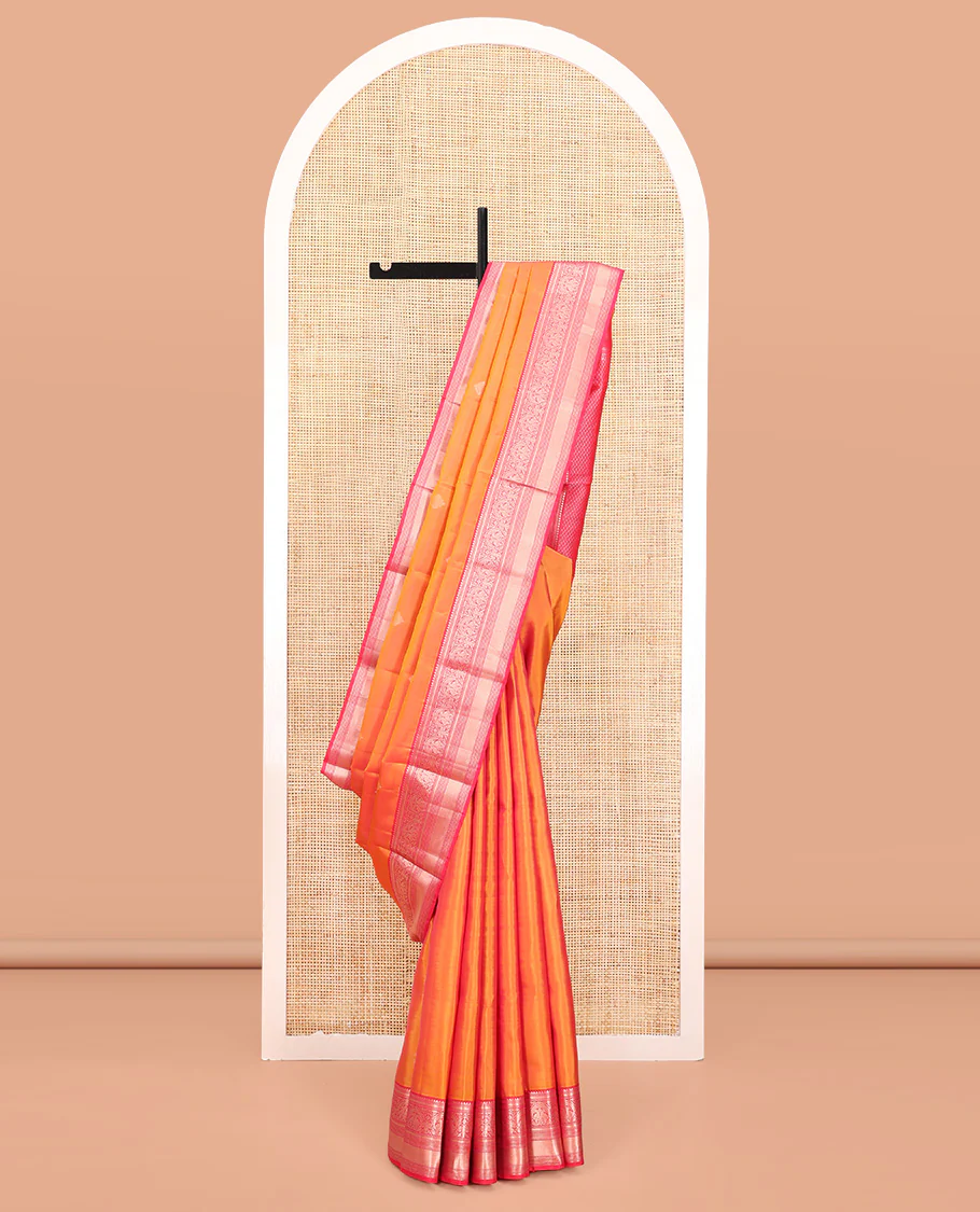 Orange Vasundhara Silk Saree, Sparsely Sparkled with Zari Buttas All Over Its Body, Complemented by a Contrast Border of Rekku, Muthu, Kili, Banaras, Neli, and Mayil Kann Designs, Grand Pallu, and Paired with a Contrast Blouse