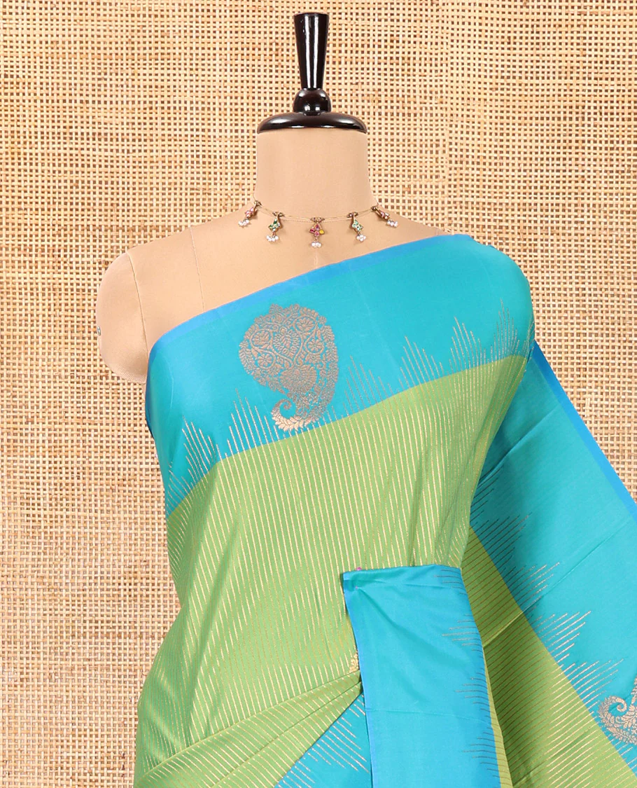 Parrot Green Kanchi Soft Silk Saree, Majestically Detailed with Vaira Oosi, and Zari Buttas All Over Its Body, Complemented by Contrast Border of Paisleys, an Intricately Designed Pallu, and Paired with a Contrast Blouse - Image 2