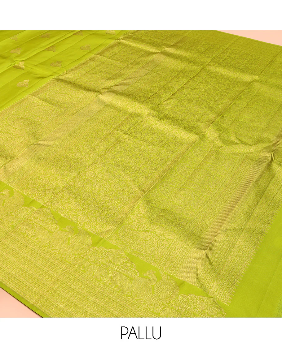 Parrot Green Kanchipuram Silk Saree, Gleamed Up with Zari Buttas All Over Its Body, Highlighted by a Zari Border of Mayil, Yaanai, and Neli Designs, Intricately Designed Pallu, and Paired with a Matching Blouse - Image 5