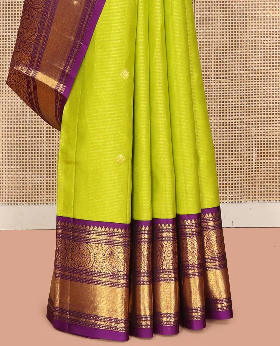Parrot Green Vasundhara Silk Saree, Enriched with Sparse Stripes and Zari Buttas, Complemented by a Contrast Border of Thilakam, Banaras, Muthu, and Round Mayil Designs, Pallu Steeped with Traditional Designs, and Paired with a Contrast Blouse - Image 9