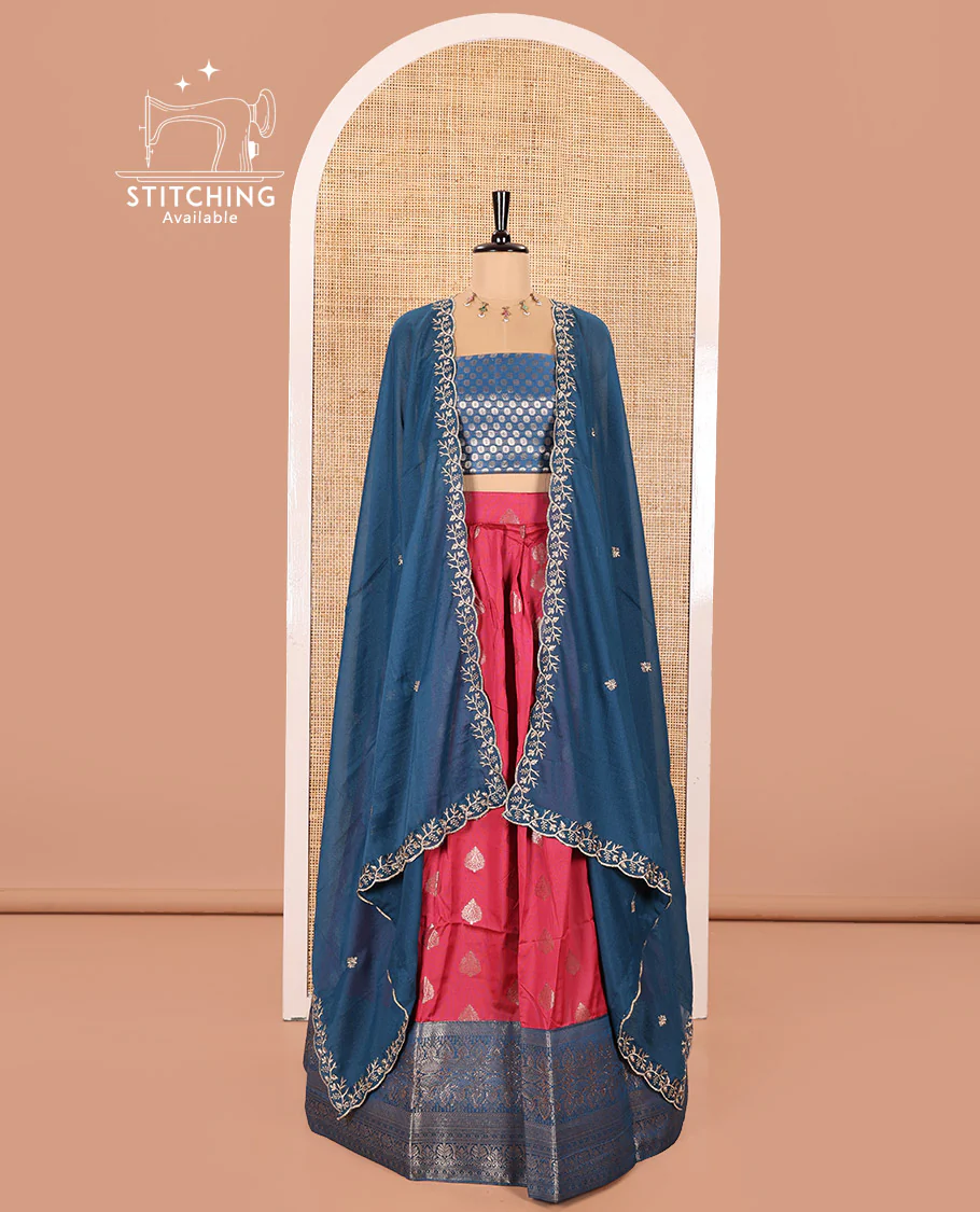 Peacock Blue and Rani Pink Semi-Banaras Silk Half-Saree Featuring Zari Buttas All Over the Skirt, Highlighted with a Contrast Traditional Zari Design Border, Rudraksham Motifs Woven Blouse, and a Shimmer Georgette Scallop-Embroidered Dhavani - Image 2