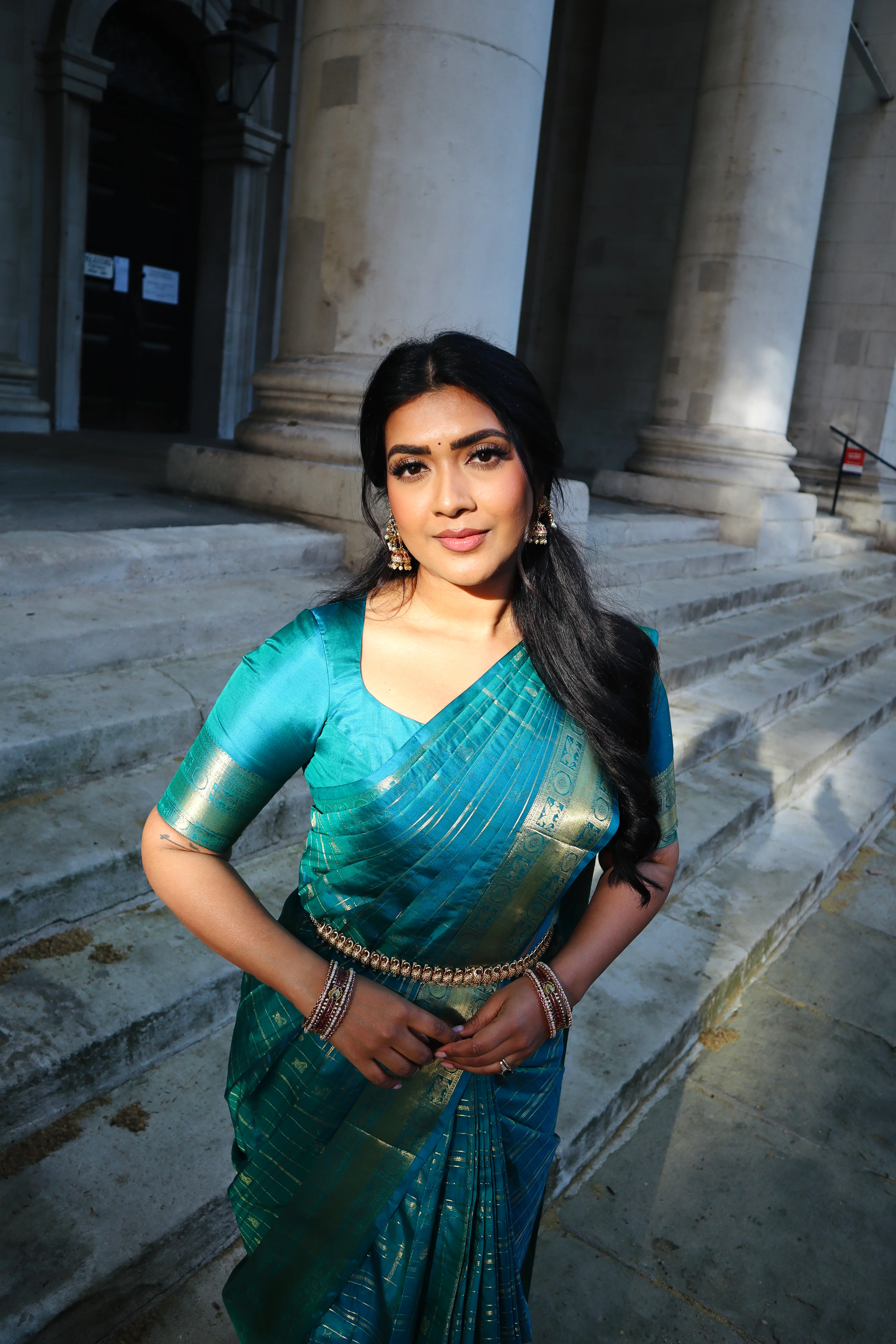 Neelambhari - Peacock Blue Vasundhara Silk Saree Gleamed Up with Zari Buttas Enclosed in Zari Checks, Featuring a Zari Border of Kuthirai and Chakra Designs, Rich Zari Pallu, with a Matching Blouse - Image 2