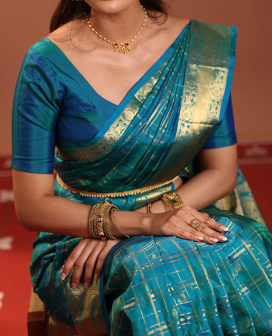 Neelambhari - Peacock Blue Vasundhara Silk Saree Gleamed Up with Zari Buttas Enclosed in Zari Checks, Featuring a Zari Border of Kuthirai and Chakra Designs, Rich Zari Pallu, with a Matching Blouse - Image 5