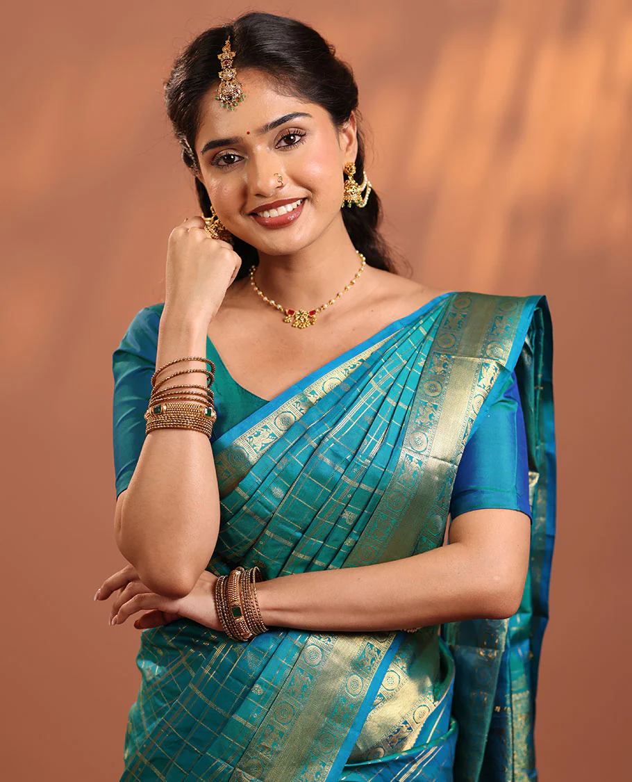 Neelambhari - Peacock Blue Vasundhara Silk Saree Gleamed Up with Zari Buttas Enclosed in Zari Checks, Featuring a Zari Border of Kuthirai and Chakra Designs, Rich Zari Pallu, with a Matching Blouse - Image 6