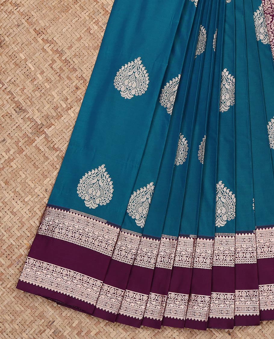 Peacock Color Budget Silk Saree, Bedecked with Zari Buttas on Its Body, Complemented by a Contrast Traditional Zari Design Rettai Pettu Border, Intricately Designed Pallu, and Paired with a Contrast Blouse