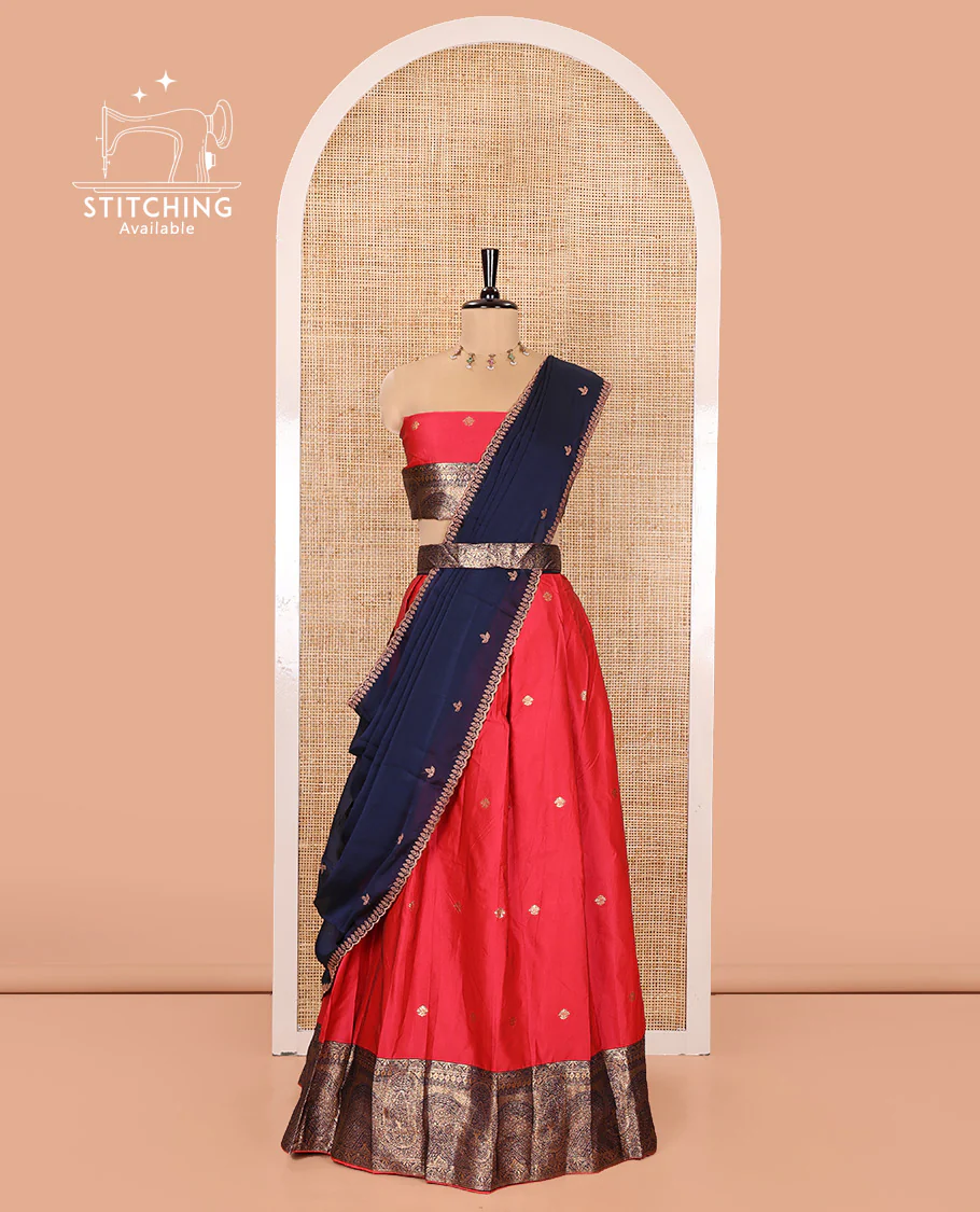 Pink and Blue Semi-Banarasi Half-Saree, Elegantly Woven with Zari Buttas on Its Skirt, Complemented by a Contrast Geometric Patterns Zari Woven Border, Paired with a Matching Blouse, and a Contrast Satin Georgette Embroidered Scallop Dhavani