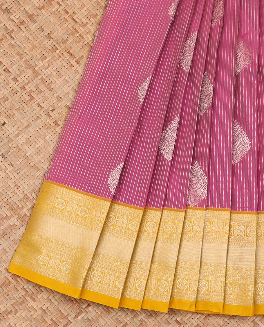 Pink Budget Silk Saree Woven with Zari Stripes and Thilakam Buttas All Over Its Body, Complemented by a Contrast Traditional Zari Design Border, Pallu Opulently Embellished with Jaal Design, and Paired with a Contrast Blouse