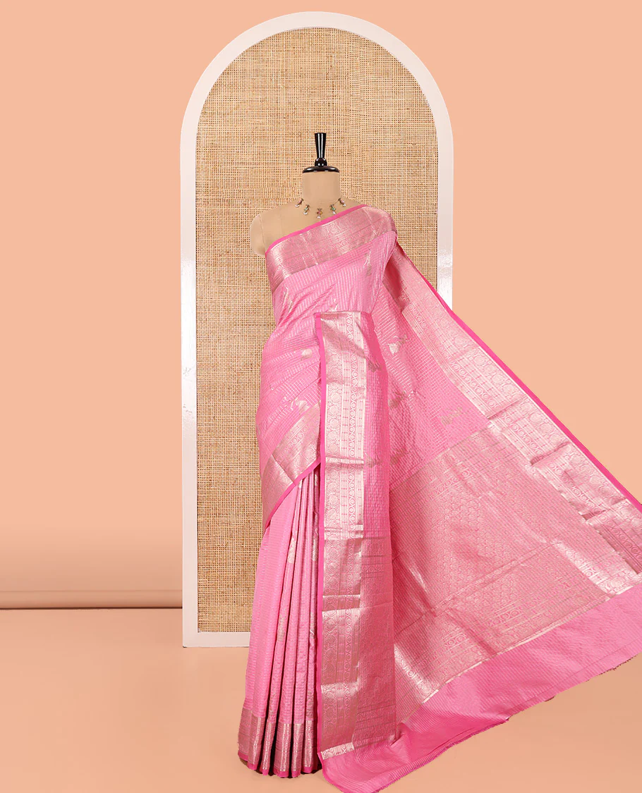 Pink Kanchi Silk Saree, Beautifully Bedecked with Zari Buttas and Zari Checks on Its Body, Highlighted by a Traditional Zari Design Border, Intricately Designed Pallu, and Paired with a Matching Blouse