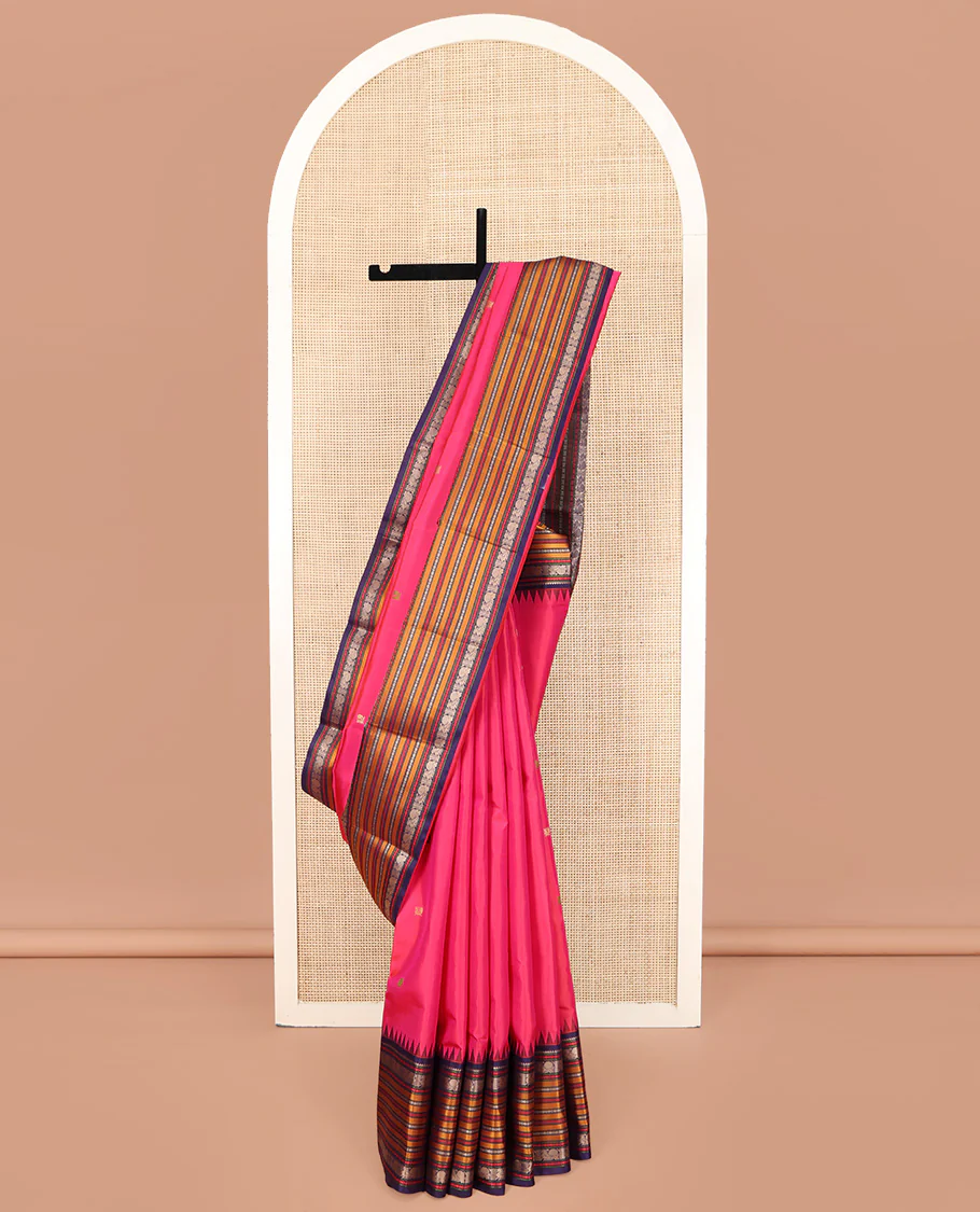 Pink Kanchipuram Silk Saree, Artfully Designed with Mayil Buttas on Its Body, Complemented by a Contrast Border of Rekku, Rudraksham, Mayil, and Kathir Designs, Pallu Steeped with Geometric Designs, and Paired with a Contrast Blouse