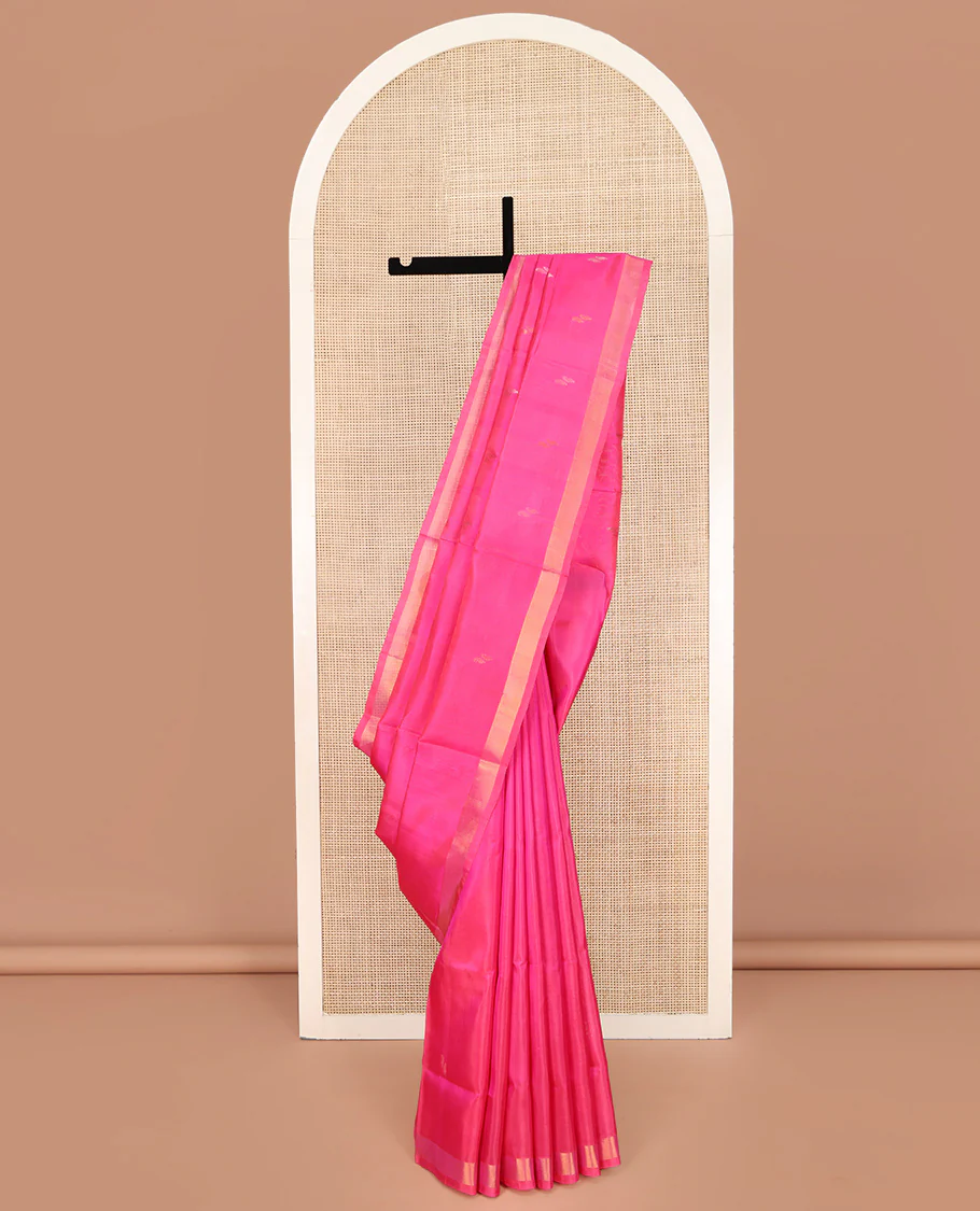 Pink Uppada Silk Saree, Subtly Sparkled with Buttas All Over Its Body, Subtle Bavanji Border, Pallu Steeped with Buttas, and Paired with a Matching Blouse