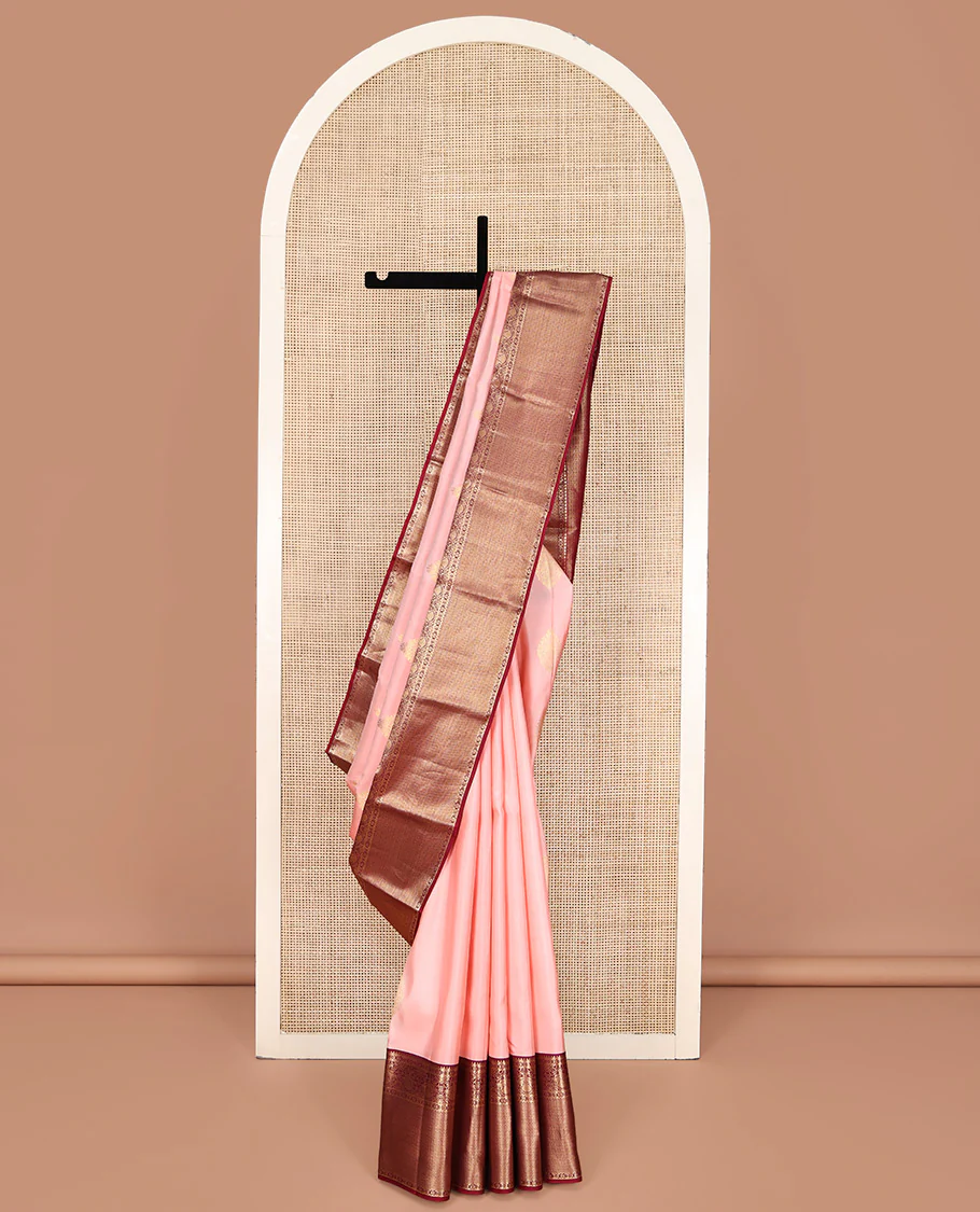 Pink Vasundhara Silk Saree, Adorned with Zari Buttas All Over Its Body, Complemented by a Contrast Border of Rekku, Iruthalai Pakshi, and Mayil Kann Designs, Grand Jaal-Patterned Pallu, and Paired with a Contrast Blouse