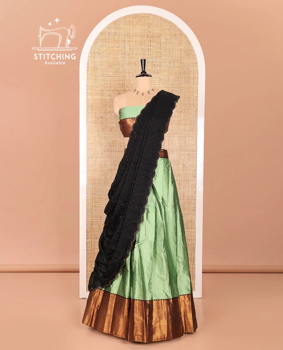 Pista Green Taffeta Silk Half-Saree Featuring a Plain Skirt, Elevated with a Contrast Traditional Zari Design Border, Paired with a Matching Blouse, and a Georgette Scallop-Bordered Stone Work Dhavani - Image 3