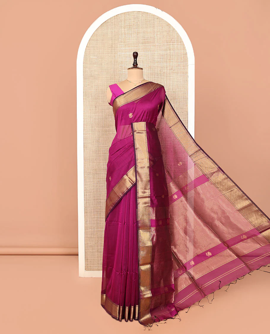 Purple Maheshwari Cotton Saree, Charmingly Accented with Floral Buttas All Over Its Body, Highlighted by  Traditional Zari Border, Pallu Steeped with Gleaming Zari Stripes, and Paired with a Matching Blouse