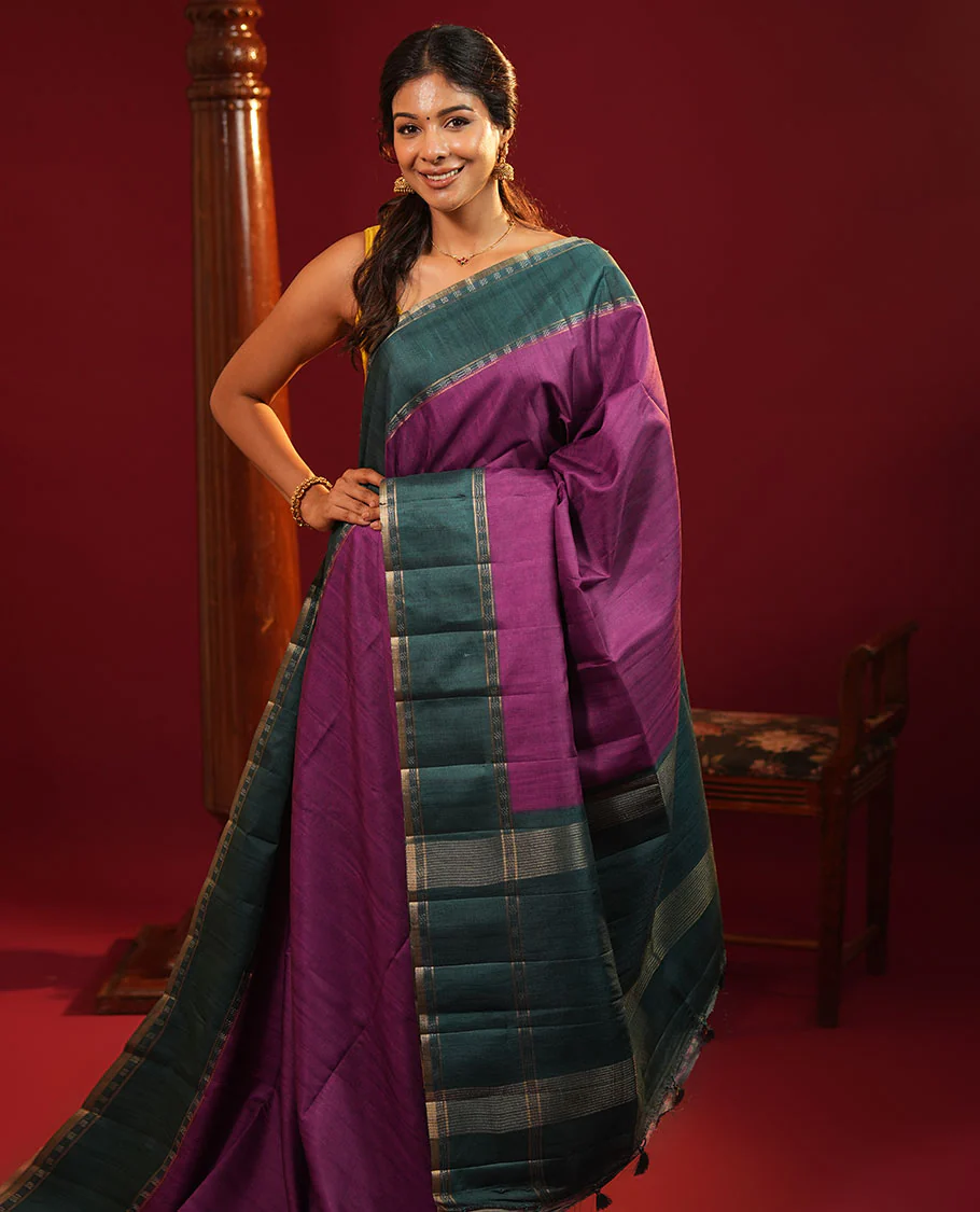 Purple Plain Semi-Tussar Silk Saree, Complemented by a Contrast Geometric Design Border, Subtly Zari Striped Pallu, and Paired with a Contrast Patola Printed Blouse