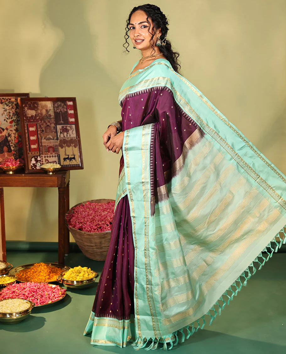 Purple Vasundhara Silk Saree, Spotlighted With Zari Buttas All Across Its Body, Complemented by Captivating Contrast Rettai Pettu Border of Thazampoo Rekku, Muthu, And Manga Designs, a Gleaming Zari Design Pallu, And Paired With a Contrast Blouse - Image 7