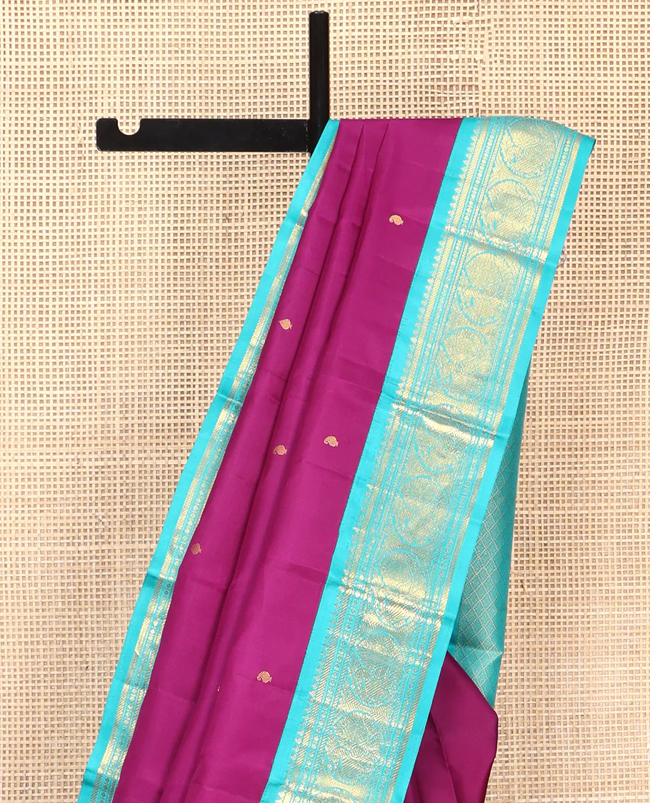 Purple Vasundhara Silk Saree, Subtly Sparkled With Zari Buttas All Over Its Body, Complemented by Zari Buttas All Over Its Body, Complemented by Contrast Border of Thilakam, Banaras, and Mayil Designs Grand Jaal Pallu and Paired with a Contrast Blouse - Image 3
