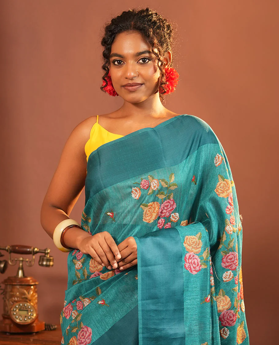 Rama Blue Green-Silk Saree, Colorfully Highlighted with Rose Motifs Cross Stitch Embroidery on Its Body, Subtly Sparkled by a Plain Border, Pallu of Rose Cross Stitch Embroidery, and Paired with a Contrast Blouse - Image 2