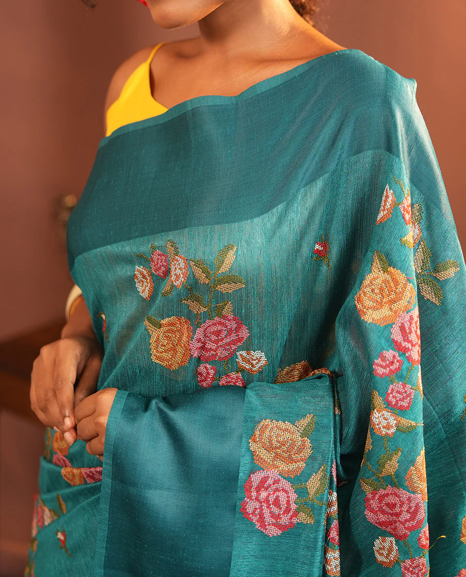 Rama Blue Green-Silk Saree, Colorfully Highlighted with Rose Motifs Cross Stitch Embroidery on Its Body, Subtly Sparkled by a Plain Border, Pallu of Rose Cross Stitch Embroidery, and Paired with a Contrast Blouse - Image 3