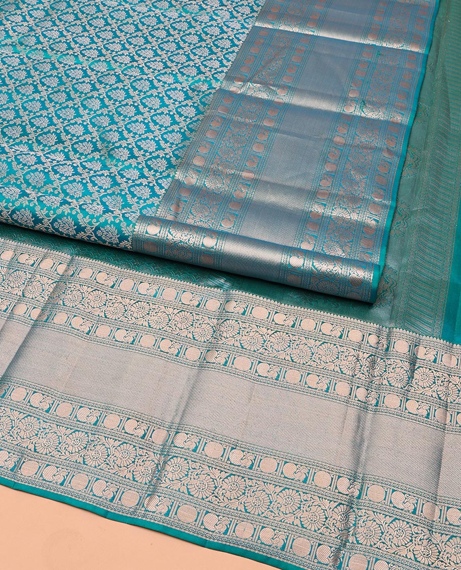 Rama Blue Kanchipuram Wedding Silk Saree, Mesmerized with Jaal Jacquard on Its Body, Highlighted by a Zari Border of Thilakam Mokku, Poun, Mayil, and Kodi Visiry Designs, Grand Pallu Steeped with Chakram Designs, and Paired with a Matching Blouse - Image 2