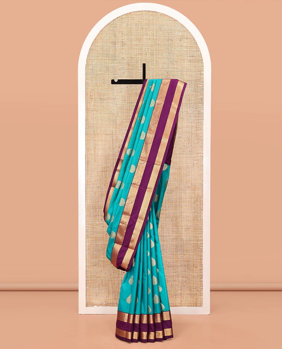 Rama Green and Purple Budget Silk Saree, Accentuated with Zari Buttas All Over Its Body, Complemented by Contrast Rettai Pettu Traditional Zari Designs Woven Border, Grand Pallu and Paired with a Contrast Blouse