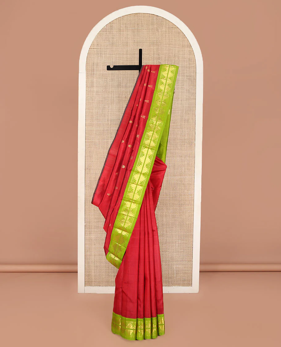 Red Kanchipuram Silk Saree, Detailed with Zari Buttas on Its Body, Complemented by a Contrast One-Sided Korvai Border of Thazampoo Rekku Designs, Pallu Depicts Zari Designs, and Comes Without a Blouse