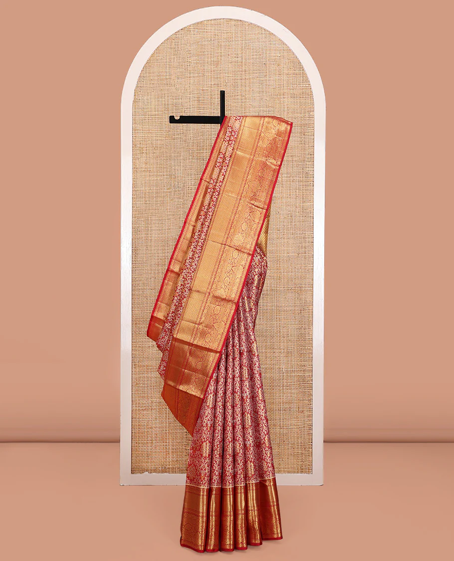 Red Kanchipuram Tissue Silk Saree, Gracefully Embellished with Jacquard Designs on Its Body, Highlighted by a Zari Border of Traditional Designs, Intricately Designed Pallu, and Paired with a Matching Blouse