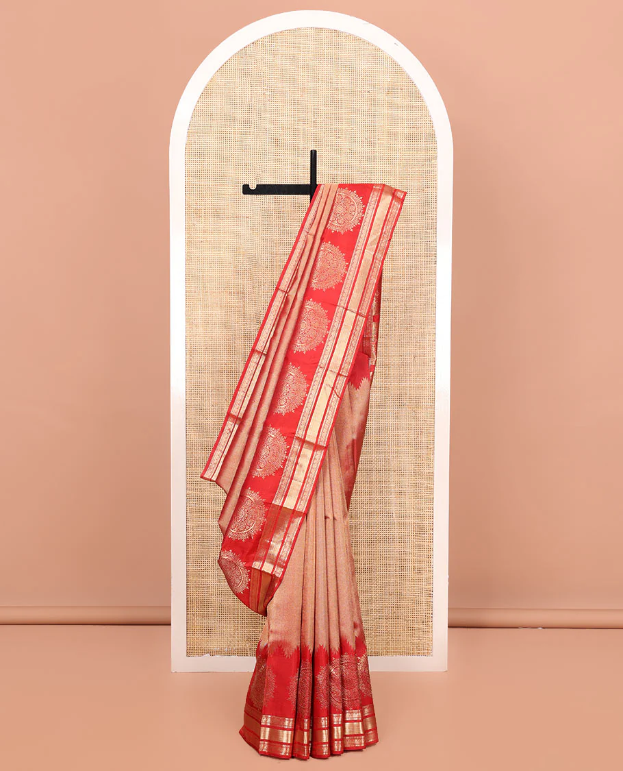 Red Kanchipuram Wedding Silk Saree, Gleamed Up with Zari and Chakram Designs on Its Body, Highlighted by a Zari Border of Muthu, Kamalam, and Vanki Designs, Intricately Designed Pallu, and Paired with a Matching Blouse