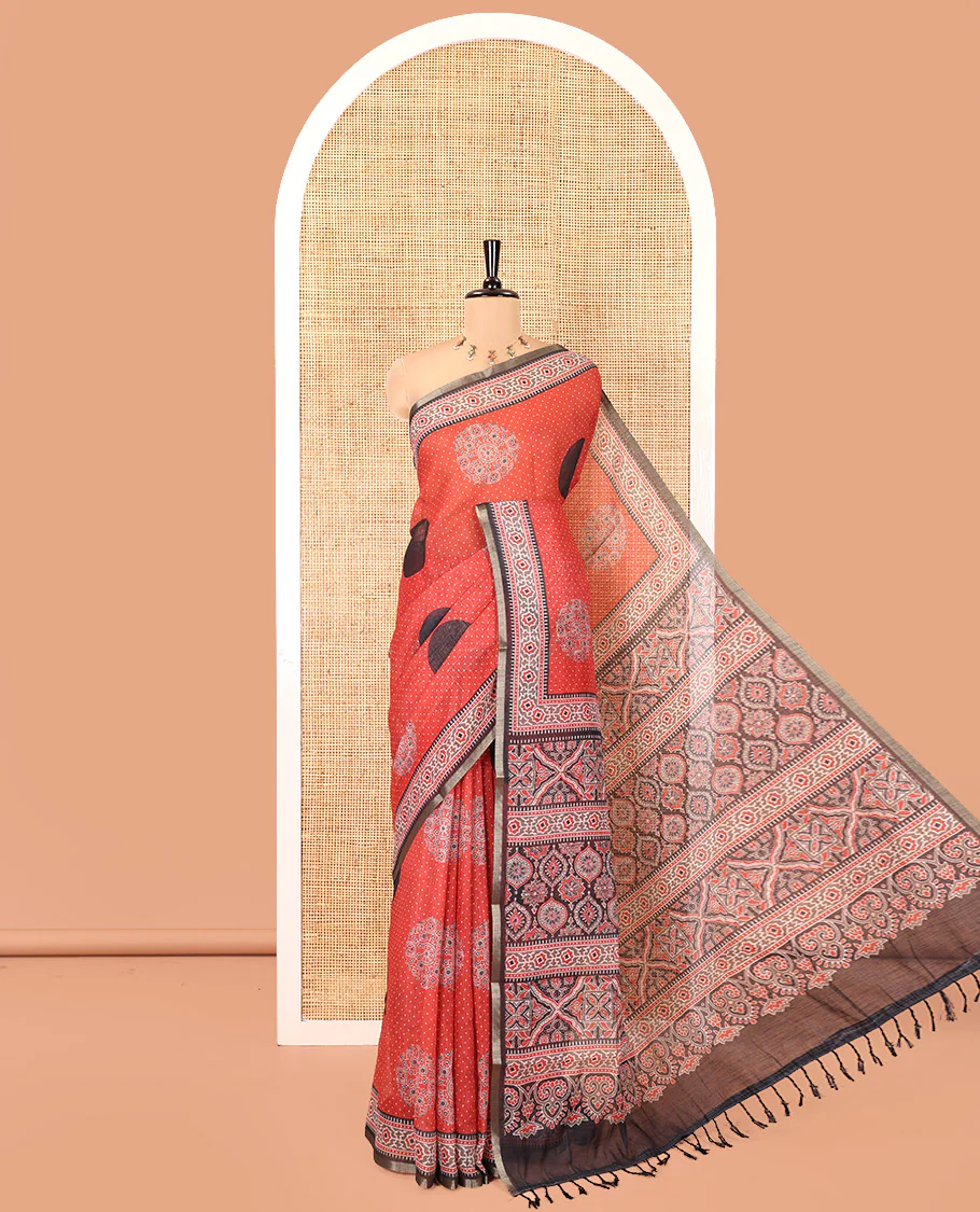 Red Linen Cotton Saree, Enthralled with Polka Dots and Ajrakh Polka Dot Printed on Its Body, Complemented by a Contrast Ajrakh Printed Border, Intricately Ajrakh Printed Pallu, and Paired with a Contrast Blouse