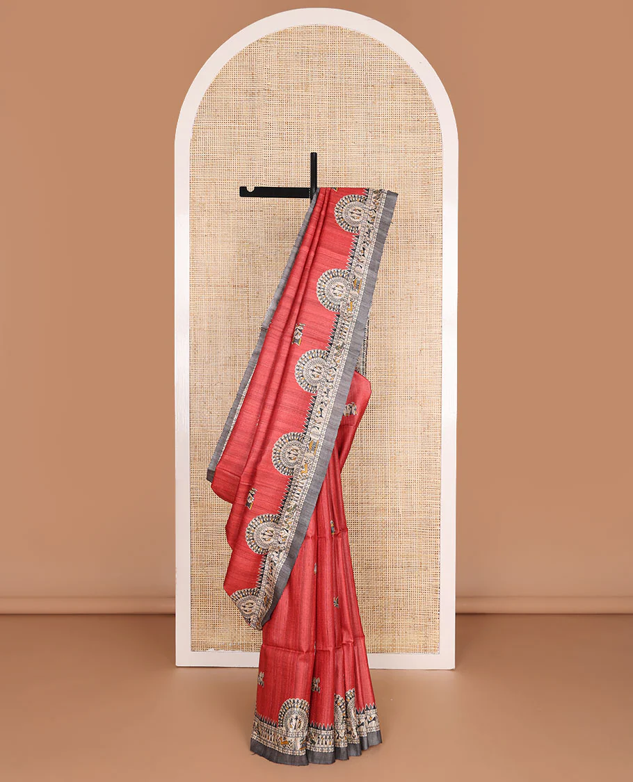Red madhubani-style human motifs printed tussar saree, contrast border & pallu elevated with madhubani-themed motifs
