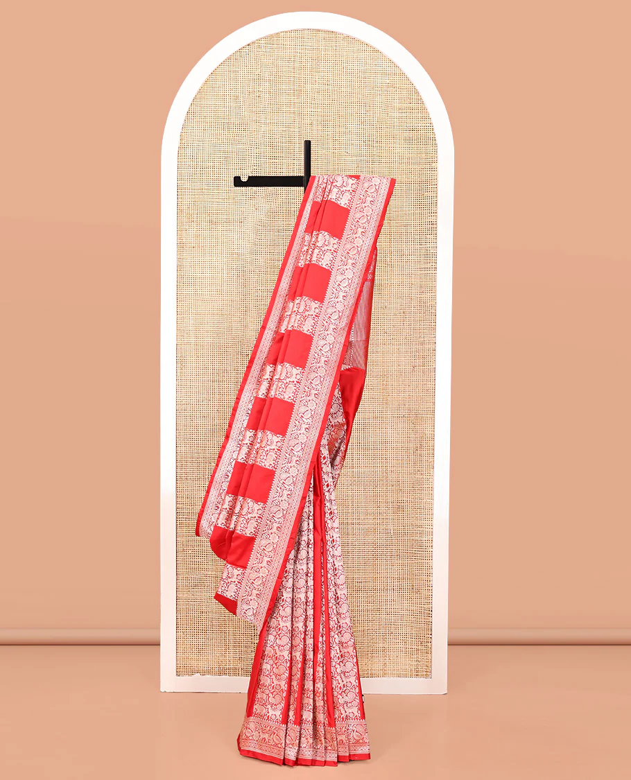 Red Mushuru Silk Saree, Gracefully Embellished with Vertically Woven Flora-Fauna Zari Designs On Its Body, Highlighted by Zari Border of Peacock and Deer Motifs, Grand Pallu, and Paired with a Plain Blouse