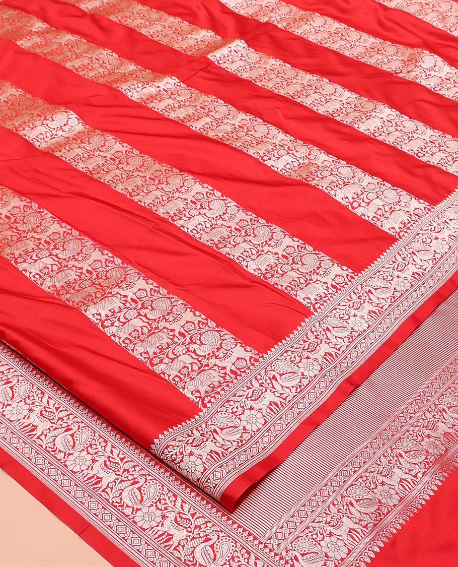 Red Mushuru Silk Saree, Gracefully Embellished with Vertically Woven Flora-Fauna Zari Designs On Its Body, Highlighted by Zari Border of Peacock and Deer Motifs, Grand Pallu, and Paired with a Plain Blouse - Image 2