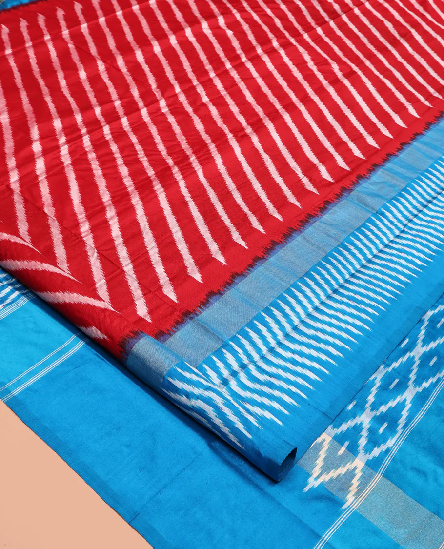 Red Pochampally Ikat Silk Saree, Delicately Woven with Stripes on Its Body, Complemented by a Contrast Border of Stripes, Pallu of Butta Enclosed Jaal Designs, and Paired with a Contrast Blouse - Image 2