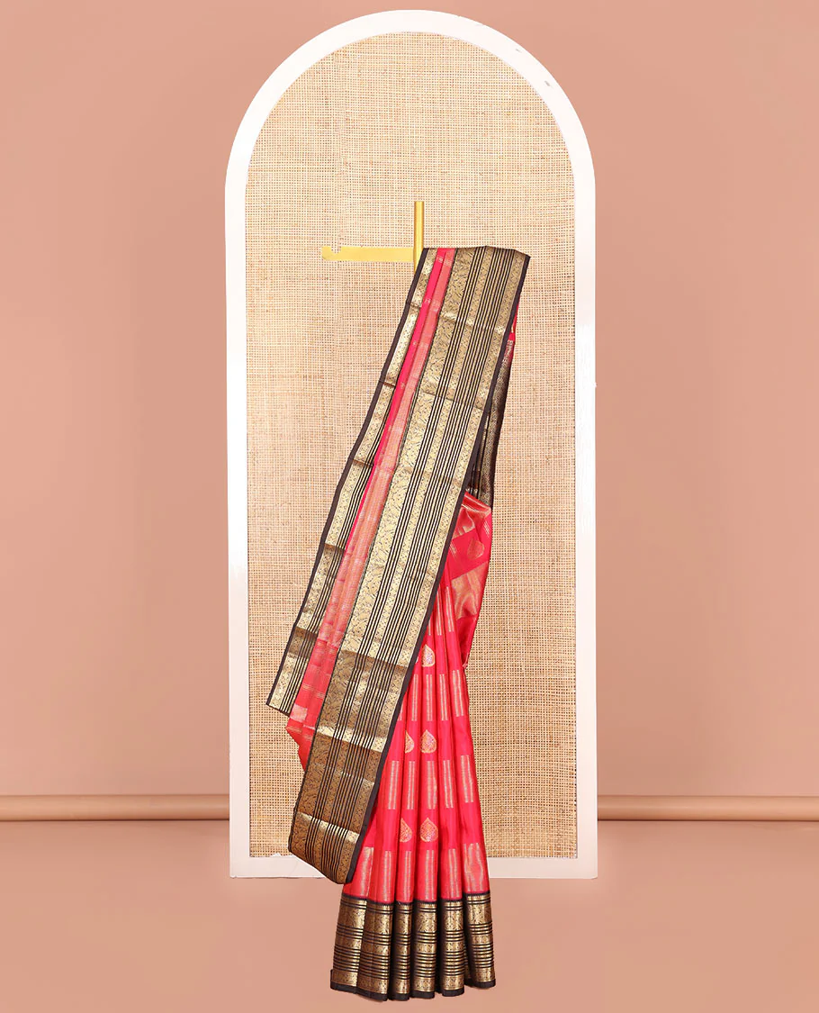 Red Vasundhara Silk Saree, Accentuated with Zari Buttas and Zari Stripes All Over Its Body, Complemented by a Contrast Border of Thilakam, Banaras, Muthu, Yaanai, Manga, and Mayil Designs, Zari Elevated Jaal Pallu, and Paired with a Contrast Blouse