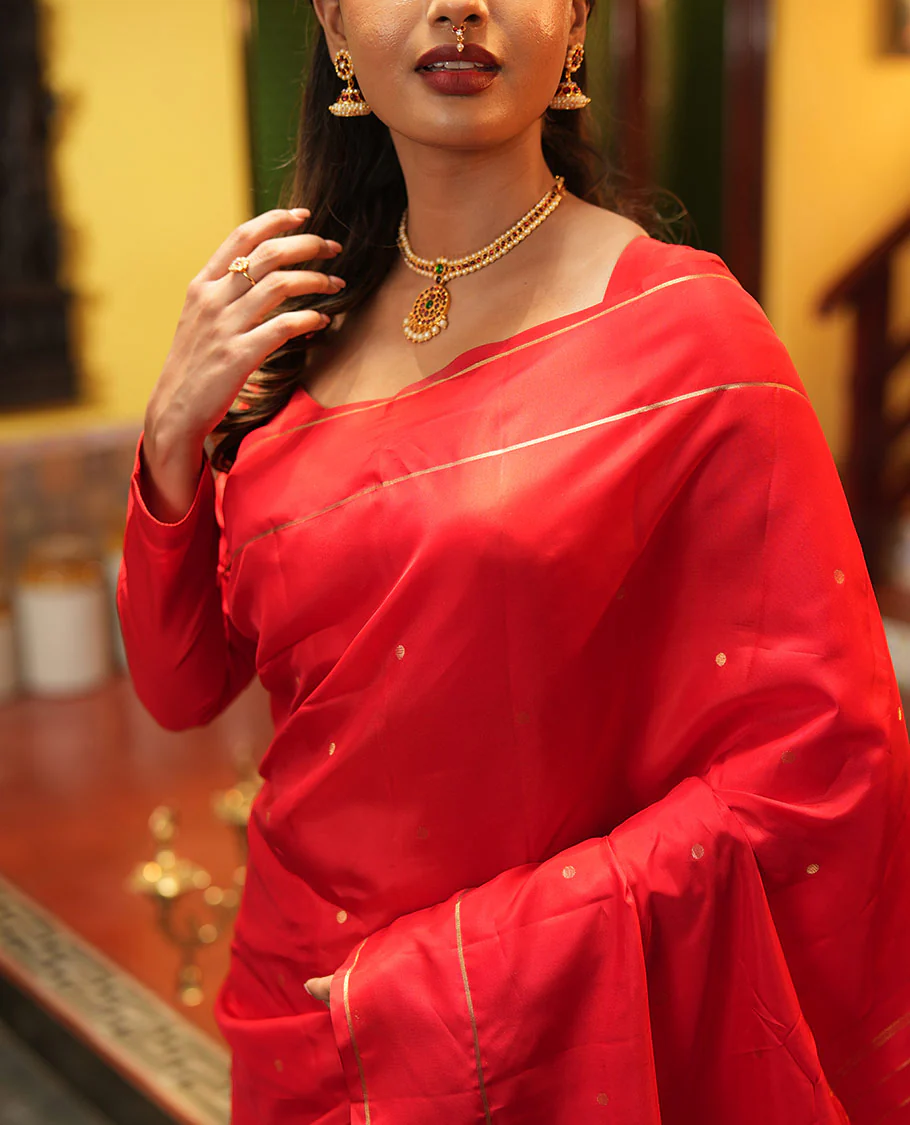Red Vasundhara Lite Silk Saree, Subtly Sparkled with Paisa Zari Buttas Across Its Body, Highlighted Zari Border of Horizontal Stripes, Gleaming Pallu of Seppu Rekku Designs, and Paired with a Matching Blouse - Image 2