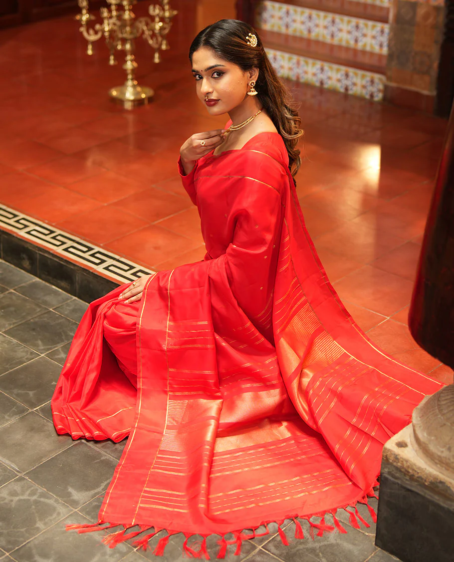 Red Vasundhara Lite Silk Saree, Subtly Sparkled with Paisa Zari Buttas Across Its Body, Highlighted Zari Border of Horizontal Stripes, Gleaming Pallu of Seppu Rekku Designs, and Paired with a Matching Blouse - Image 4