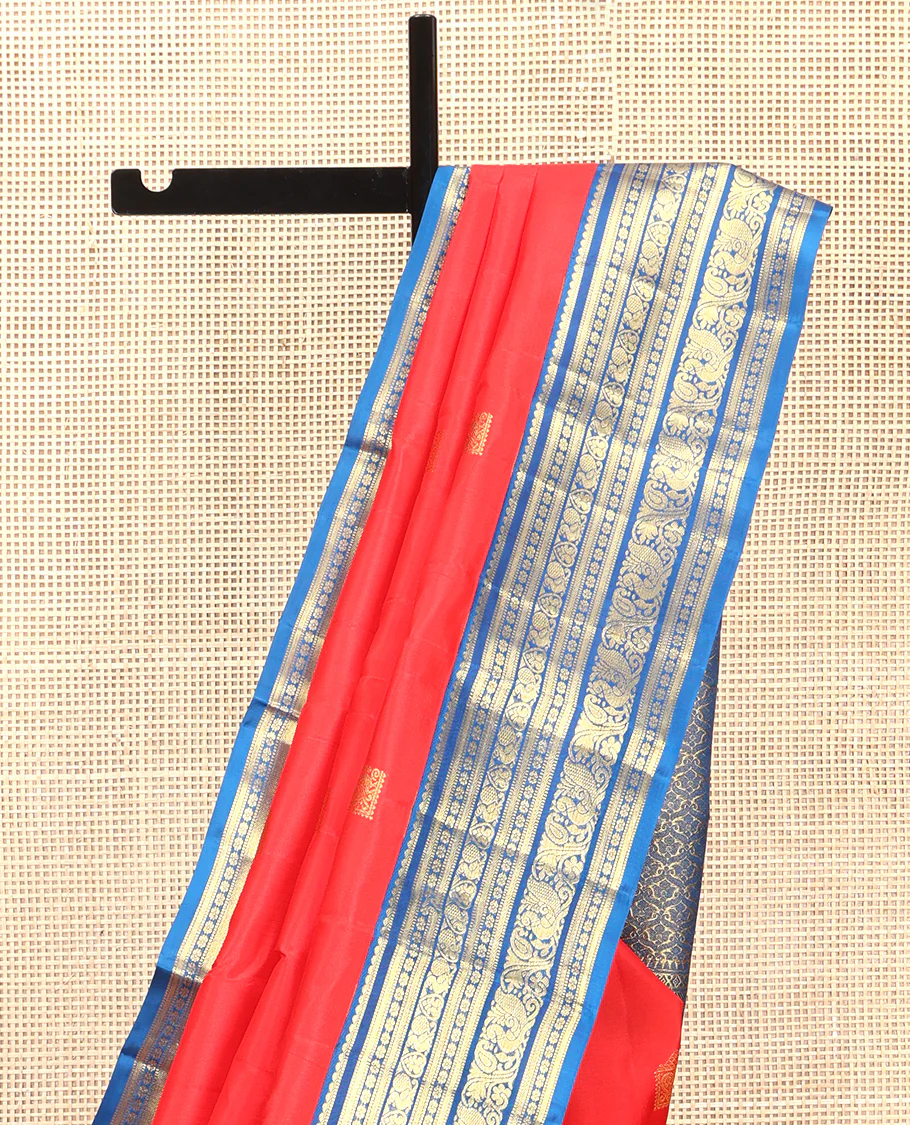 Red Vasundhara Silk Saree, Subtly Sparkled With Zari Buttas All Over Its Body, Complemented by Contrast Border of Salngai, Muthu, Kamalam, Jada Nagam, and Mayil Designs, Grand Pallu and Paired with a Contrast Blouse - Image 3